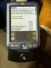 Palm Zire 71 c/w Desktop Cradle Holder  AC Power Adapter battery untested.