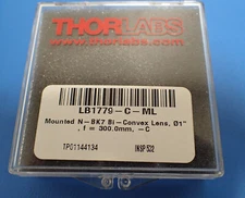 THORLABS LB1779-C-ML MOUNTED N-BK7 BI-CONVEX LENS F = 300.0 mm ARC: 1050-1700 nm