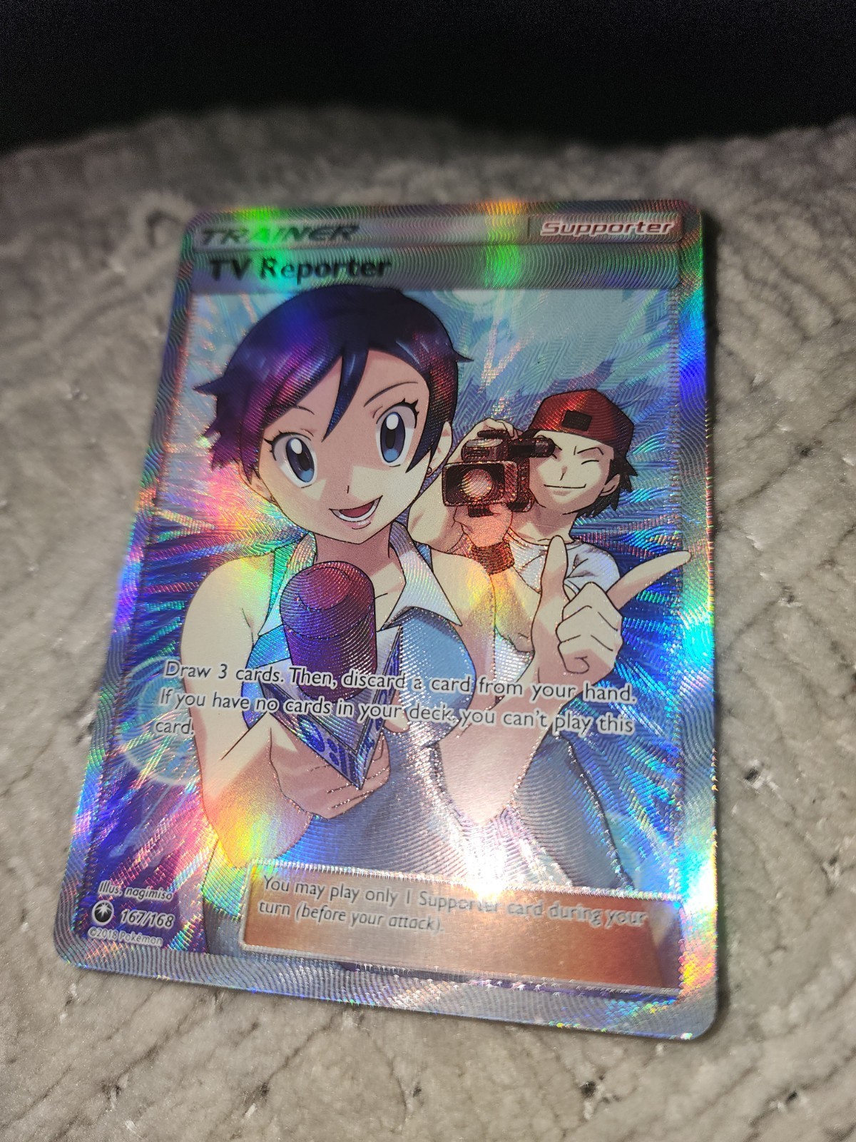 TV Reporter (Full Art) 167/168 Sm-Celestial Storm Holo