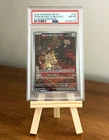 PSA 8 Team Rocket's Meowth 203/182 Sv10: Destined Rivals Illustration Rare Holo