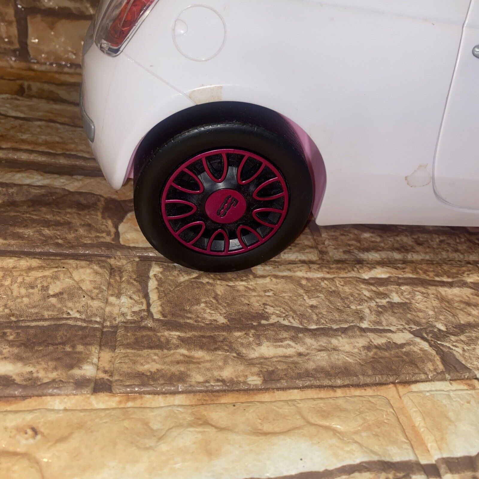 Kent, uk, 01.01.2023, A Barbie Pink Fiat 500 Car Sports Toy