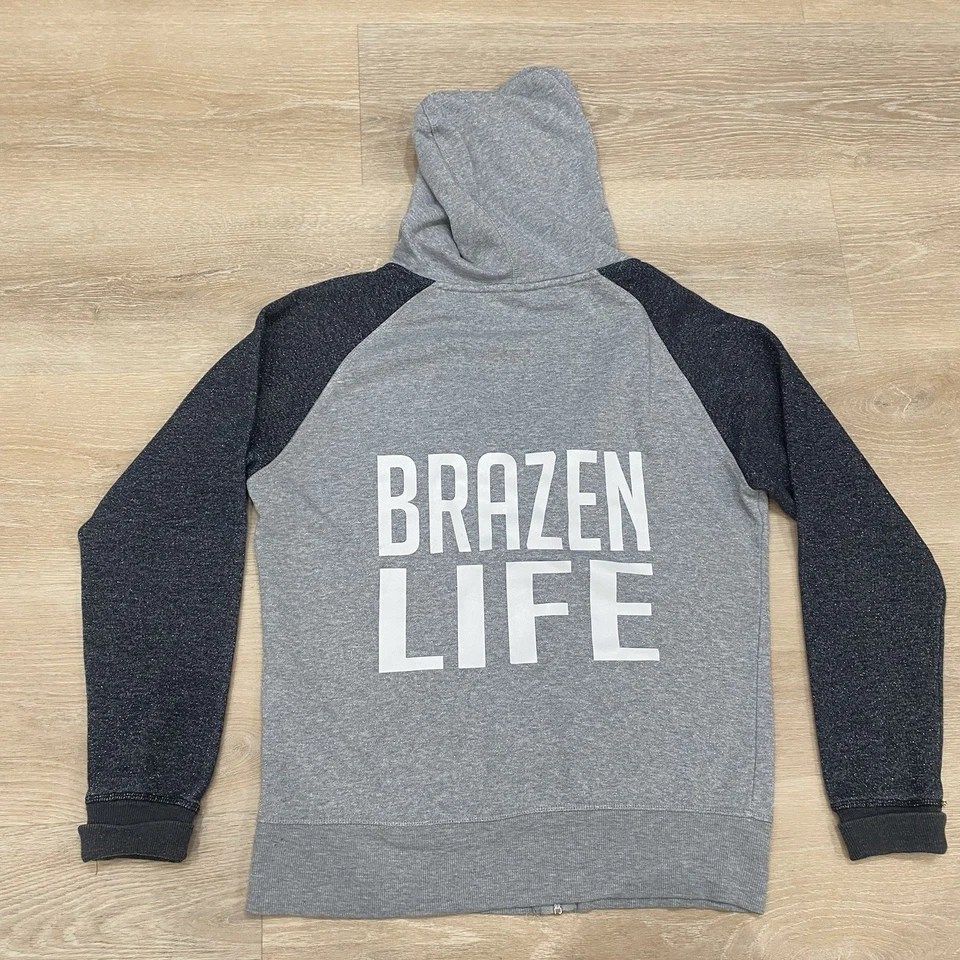 Sudadera con Capucha Para Mujer J. America Leaf Brazen Life Brillo Raglán Cremallera Gris Talla Grande Foto 2 de 4