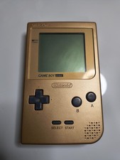 Gameboy Pocket console with aftermarket gold shell. Works Good.