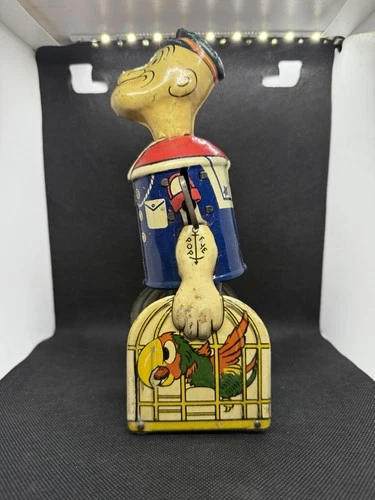 Vintage Louis Marx & Co. tin wind-up Popeye walking toy with parrot 1930s