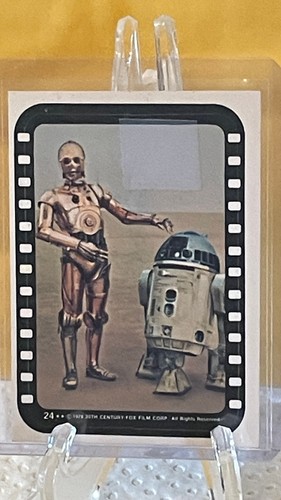 1977 Topps Star Wars Stickers #24 Droids on the sand planet — TAG (grade unconfirmed)