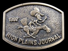 SB15107 NOS VINTAGE 1997  HIGH PLAINS JOURNAL  ADVERTISEMENT BELT BUCKLE