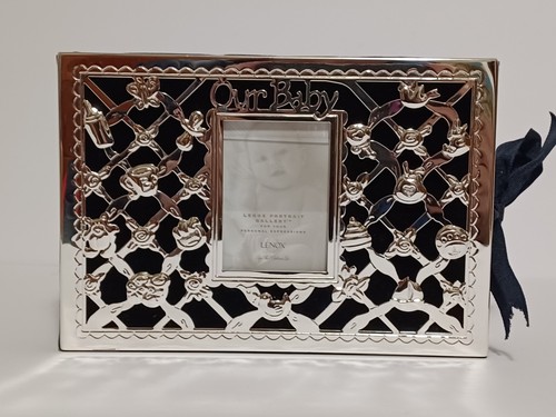 Our Baby Silverplate Photo Album by Lenox holds up to 80 4x6 Inch Photos