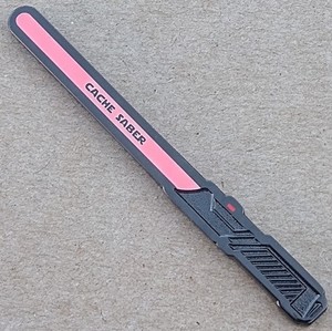 Cache Saber Geocoin - Black Nckl. w/ Pink Glow - Activated & Adoptable - TB7DJ96
