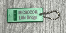 Vintage 90s Microcom LAN Bridge Keychain Whistle Green Plastic Promo Made in USA
