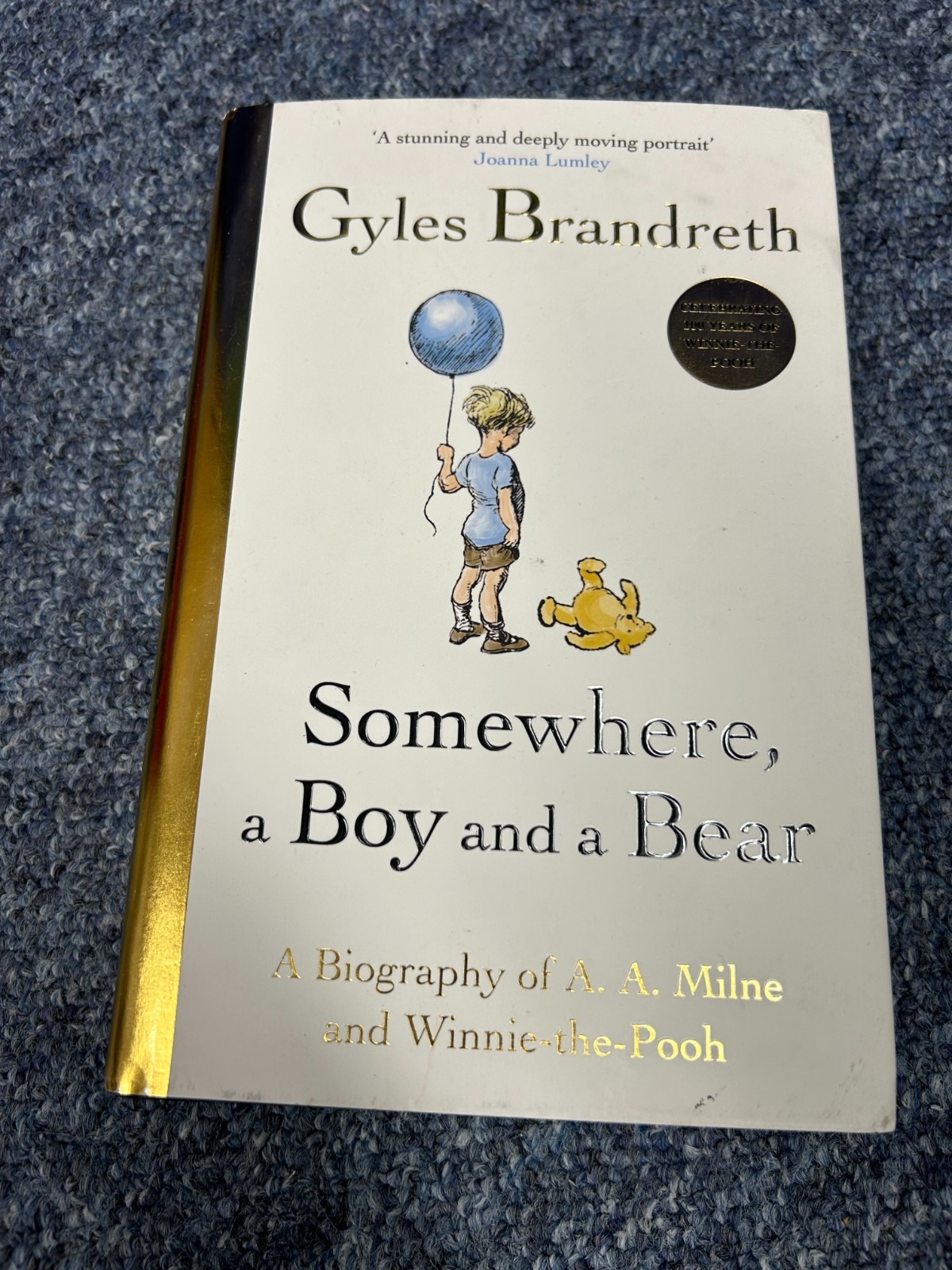 Somewhere, a Boy and a Bear: The Remarkable Life of A.A. Milne (Hardback)
