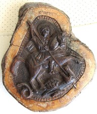 Carved plaque of St George slaying the dragon