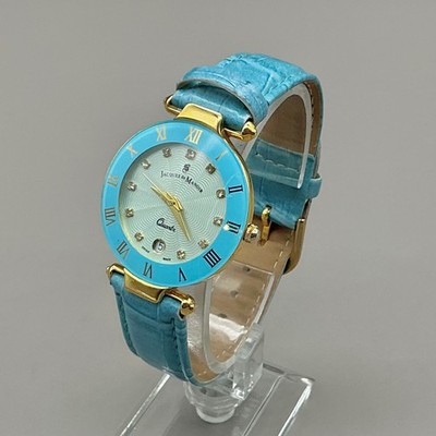 Jacques du Manoir Watch Women Gold Tone Blue Roman Numeral Date NEW BATTERY