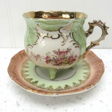 Iridescent Cup and Saucer vintage green flora...