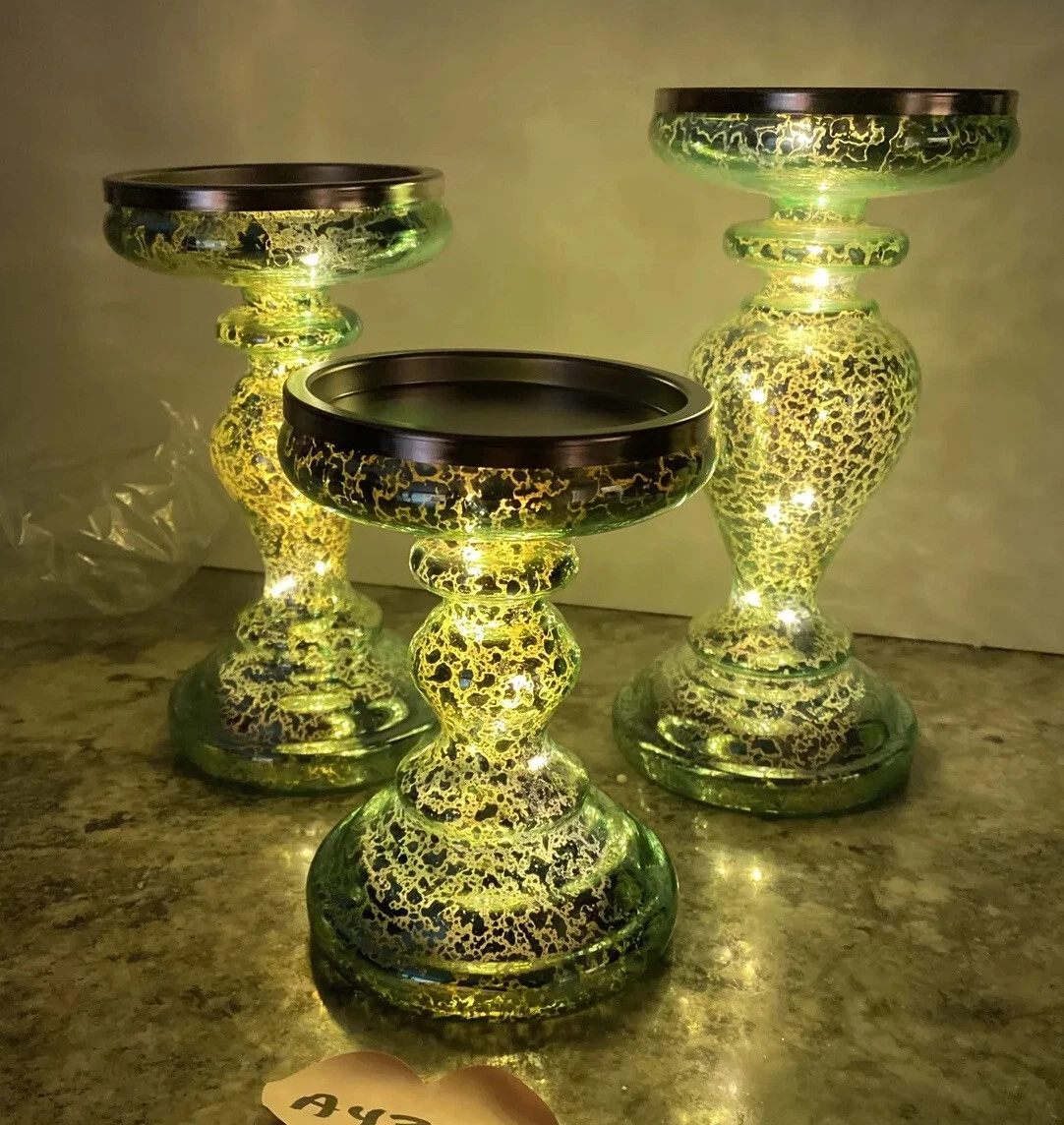 Metallic glass clearance candle holders