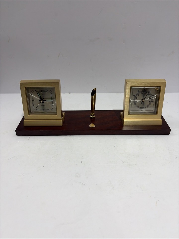 A complete Bulova mid-century desk set — alarm clock, thermometer, and pen holder in wood and brass — a cohesive MCM statement piece that's hard to find intact.