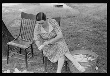 Demonstrating process of canning corn at community canning kitchen - Old Photo 1