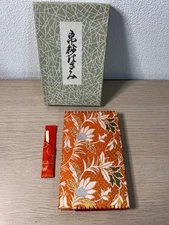 Japanese accessories with orange floral pattern