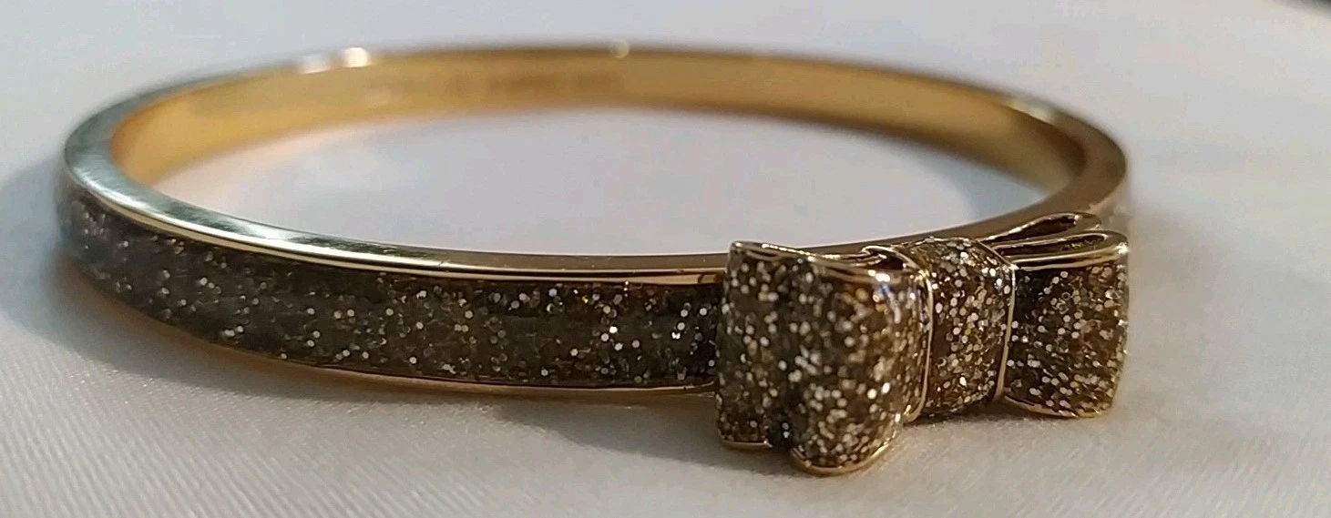 Bracciale Kate Spade Moon River glitter tono oro fiocco