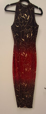 Sleeveless black-to-red bodycon dress with gold floral pattern.