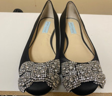 Women "Betsy Johnson " black flat shoes with rhinestone bows on toe. Size 7B