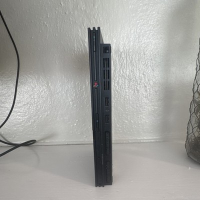 Sony PlayStation 2 Slim Console with accessories and one DualShock 2 controller