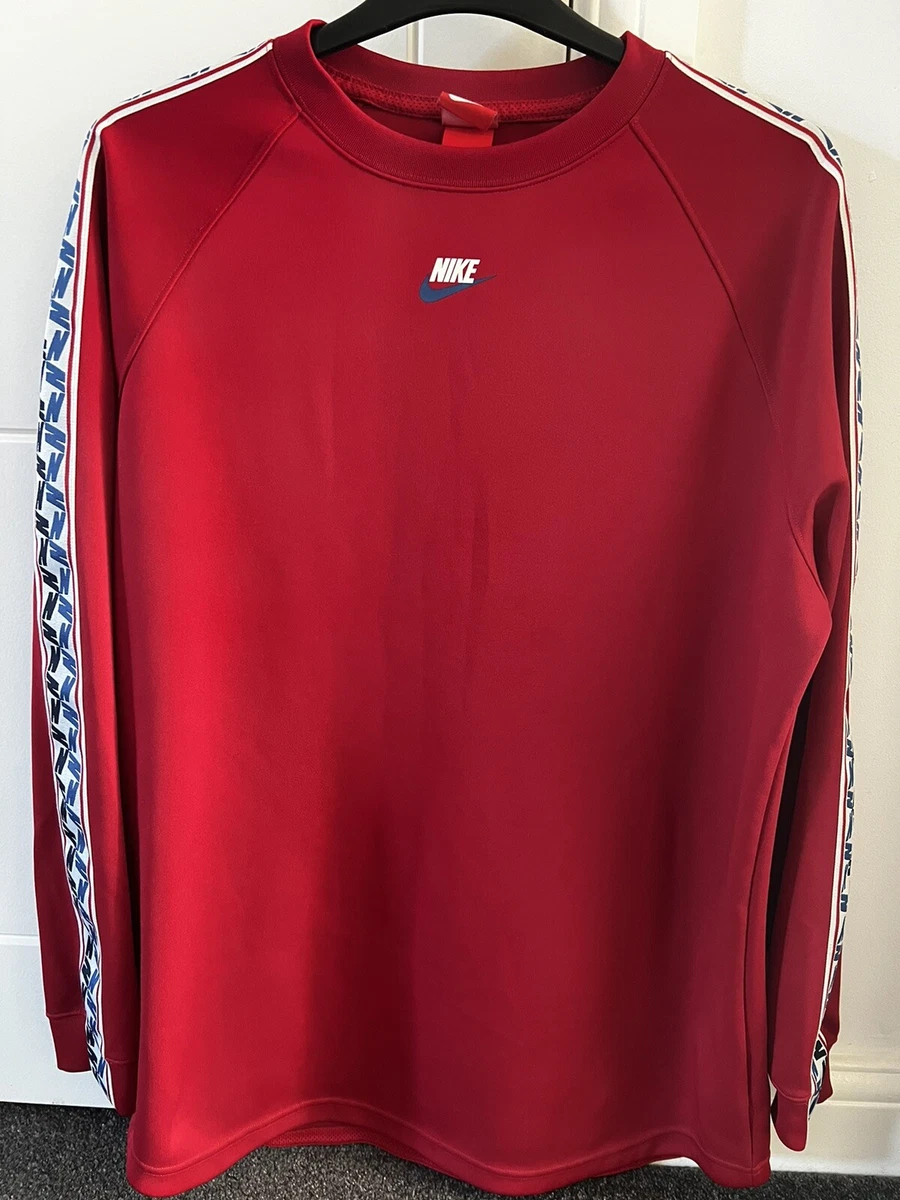 Nike long sleeve top with taped side stripe discount