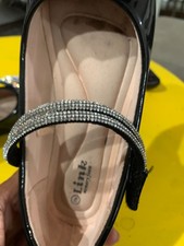 Girls Link black patent Mary Jane flats, size 2. Features rhinestone bow detail