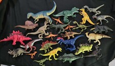 Lot of 26 dinosaur toys.