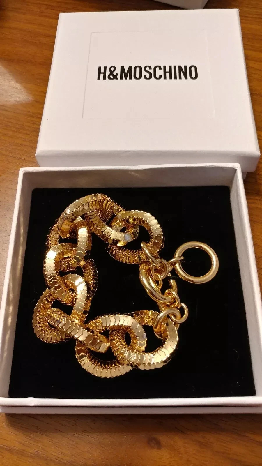 bracciale oro moschino x hm