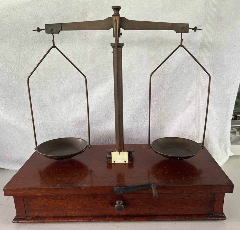 A genuine Seederer-Kohlbusch precision assay balance — the actual tool once used to weigh gold and silver, with all the dramatic brass-and-glass presence to prove it.
