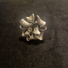 Silvertone Flower/Knot Ring with Centre Crystal Adjustable Size New