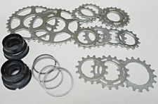 Regina Extra NOS – two freewheel sprocket carriers & assorted cogs 7sp parts lot