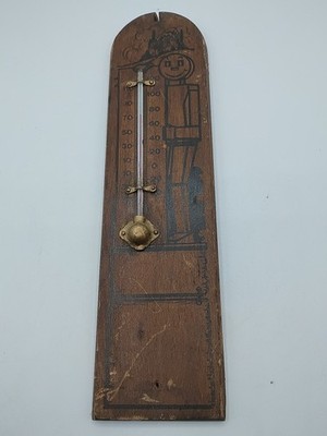 Antique wooden wall thermometer with block man advertisement