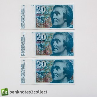 SUIZA: 3 x 20 billetes de franco suizo con números de serie consecutivos.