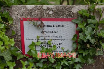 PHOTO  BRIDGE E13/9 ETF BURNETT'S LANE NETWORK RAIL'S SIGN ON RAILWAY BRIDGE. FO
