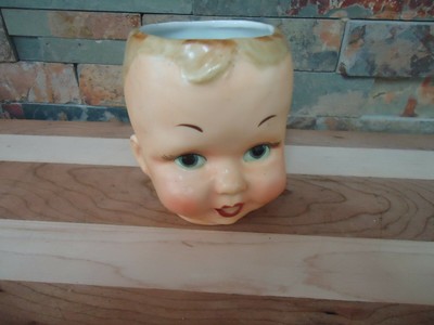 creepy baby doll face