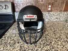 Casco de fútbol americano Riddell Revo Speed mate plano negro con mascarilla adulto mediano