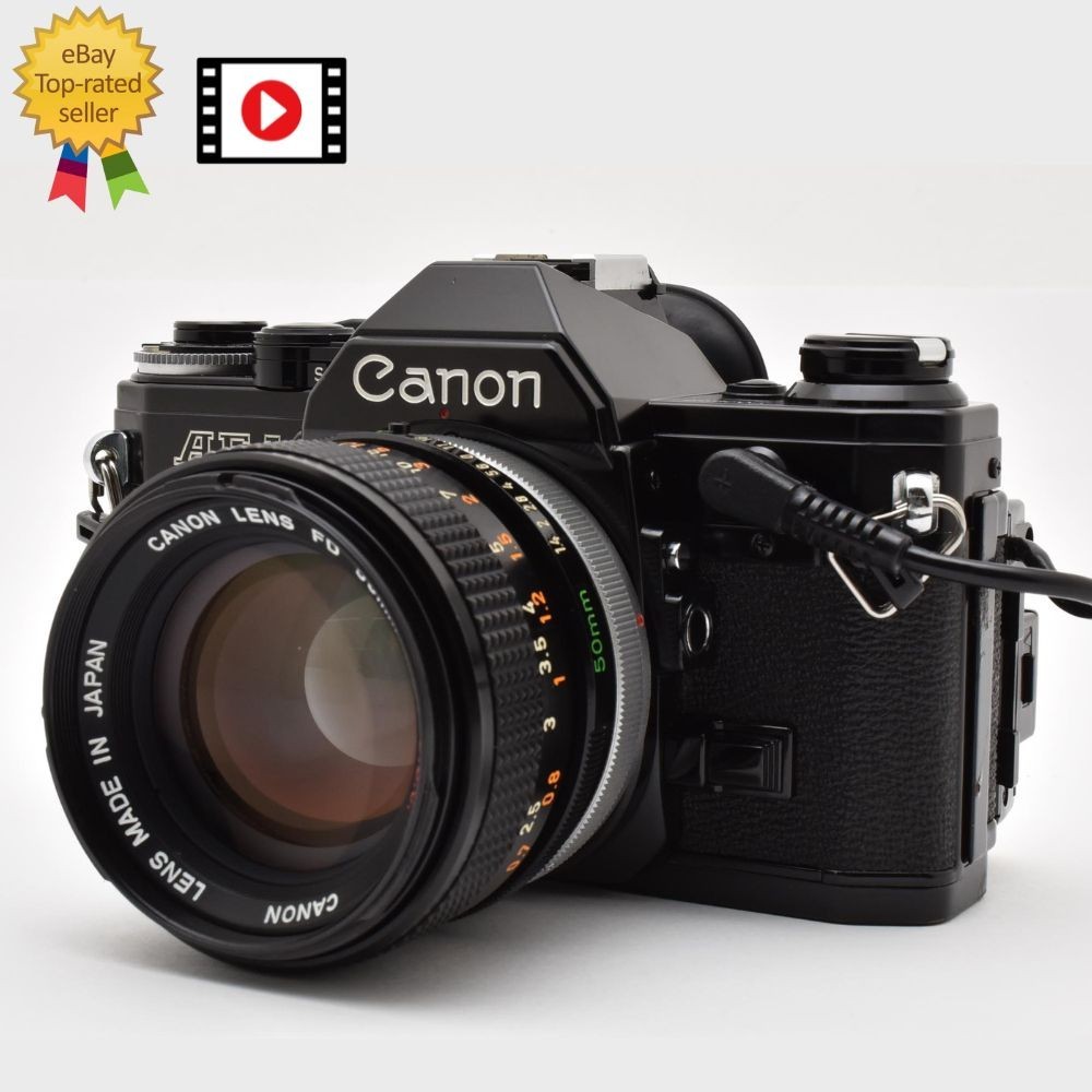 【完動品】Canon AE-1 bk / FD 50mm F1.4 S.S.C. NEAR MINT w/Data Back] Canon AE-1 black Film Camera FD 50mm