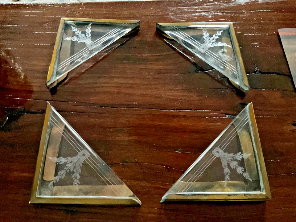 Set of four antique etched crystal and brass blotter corners — exquisite Victorian desk accessories that are genuinely rare finds.