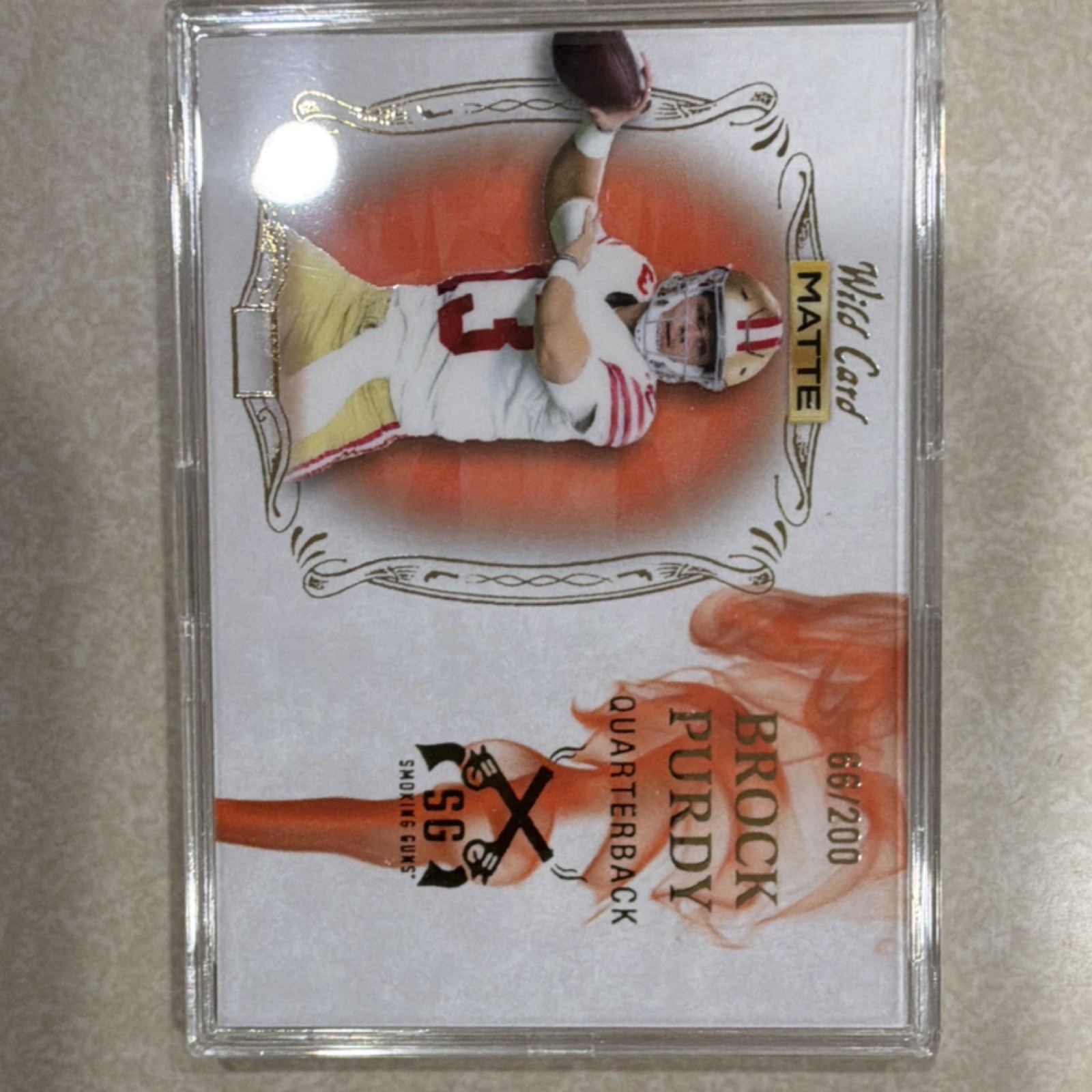 Brock Purdy Wild Card Matte Black Draft Pick Smoking Guns #11 Orange