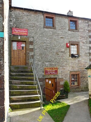 Foto 6x4 Clogmaker und Uhrenladen, Caldbeck liegt in einer ehemaligen Wassermühle um 2009