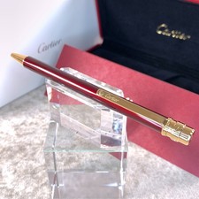 Bolígrafo Cartier Santos Burdeos Laca Acabado Dorado con Estuche y Papeles