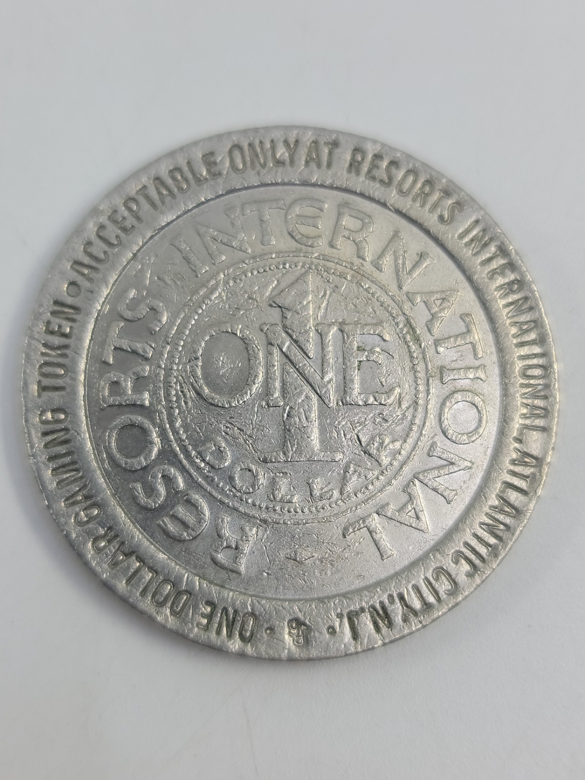 International Resorts 1$ Metal Casino Poker Chip Coin 1987 Atlantic City