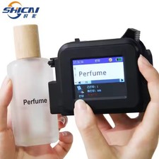 Mini handheld inkjet printer prints date, logo text, variable data