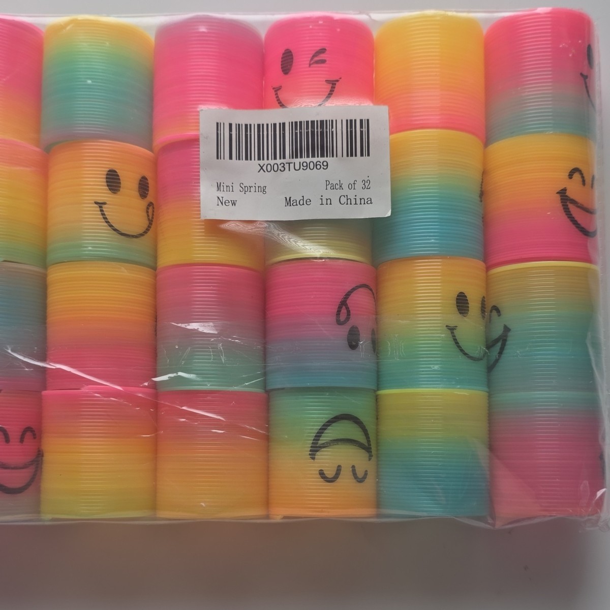 Mini Spring Slinky Toys Pack of 32 Multicolor Smiley Face