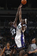 Forward Tim Thomas Milwaukee Bucks jumps for the ball with forwar- 2002 Photo