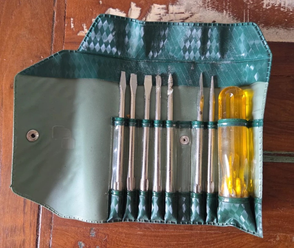 A vintage German 8-piece 1000V insulated interchangeable screwdriver set in its original pouch — the kind of serious, beautiful tool engineering that doesn't exist at this price anymore.