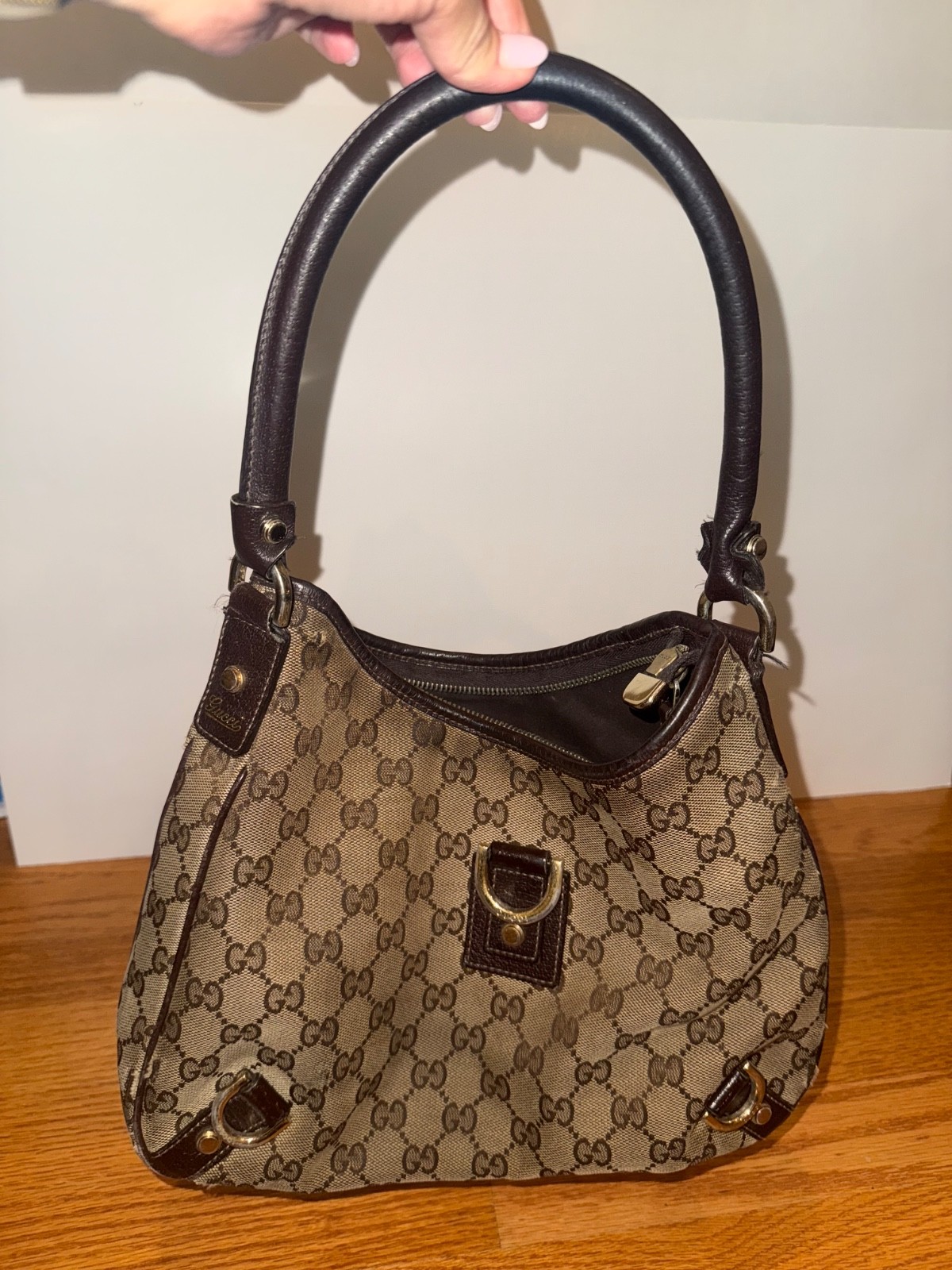 authentic used gucci hand bag; medium condition;  light brown