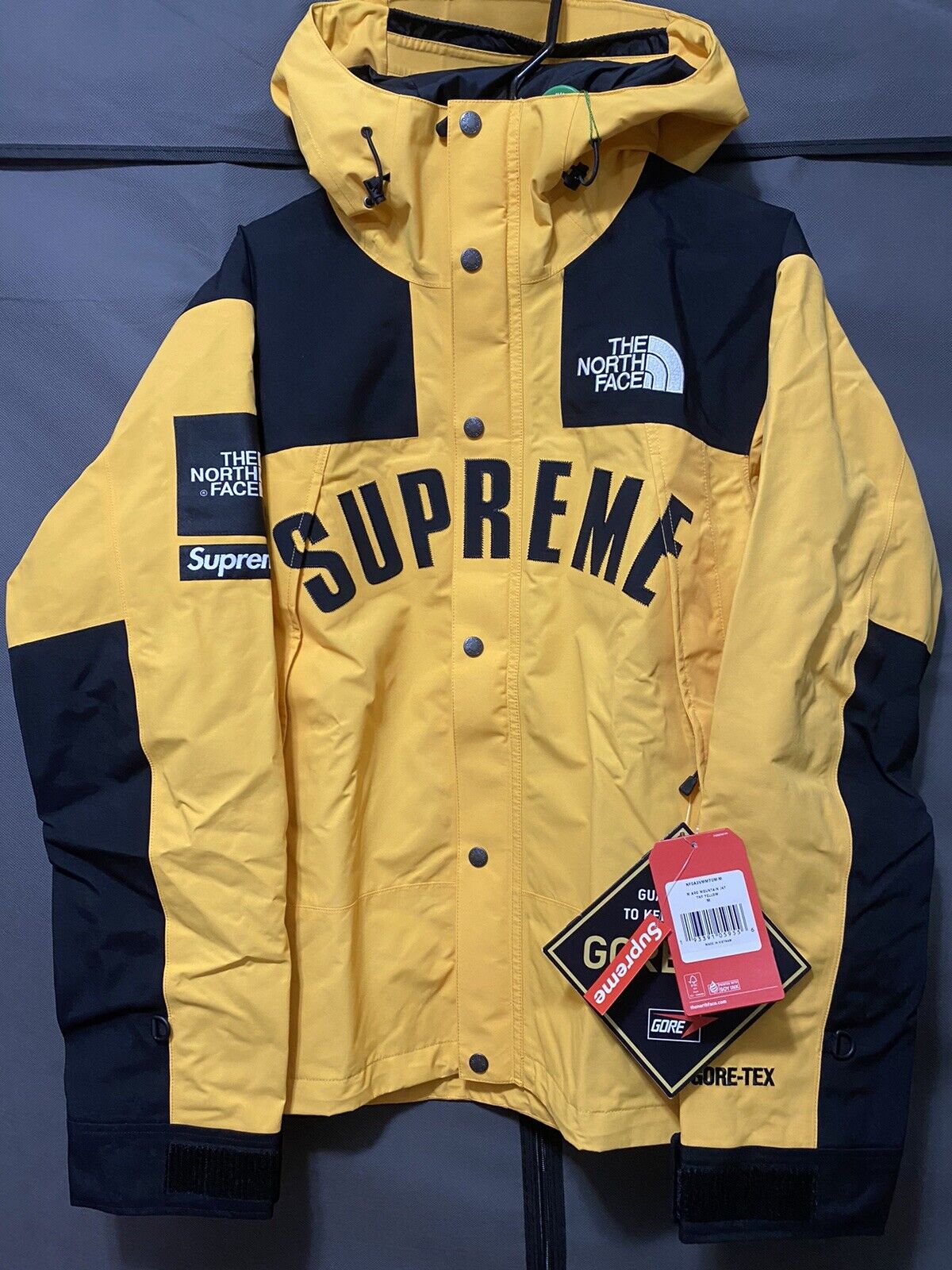 yellow supreme north face jacket