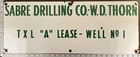 Vintage Porcelain Oil Field Sign - Sabre Drilling Co WD Thorn TXL "A" Lease